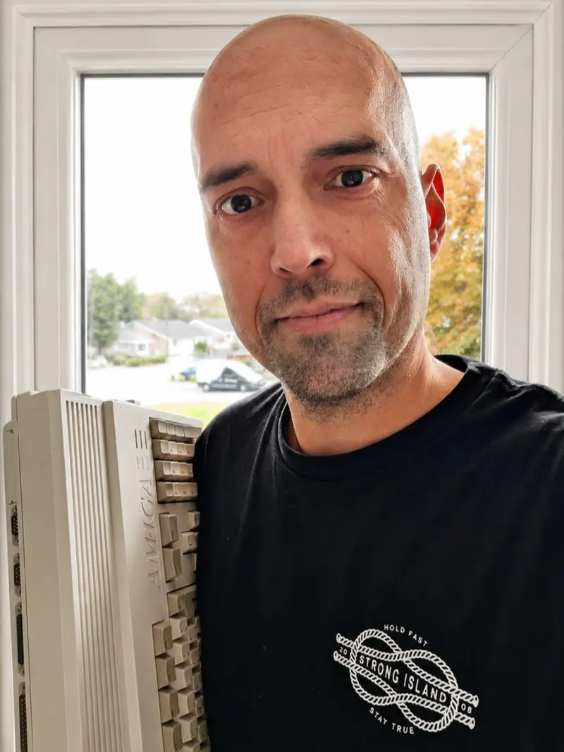 Scott beside his vintage Amiga computer